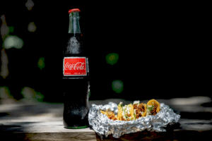 Напій Coca-Cola з тростинним цукром